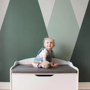 Coffre à jouets blanc avec coussin gris